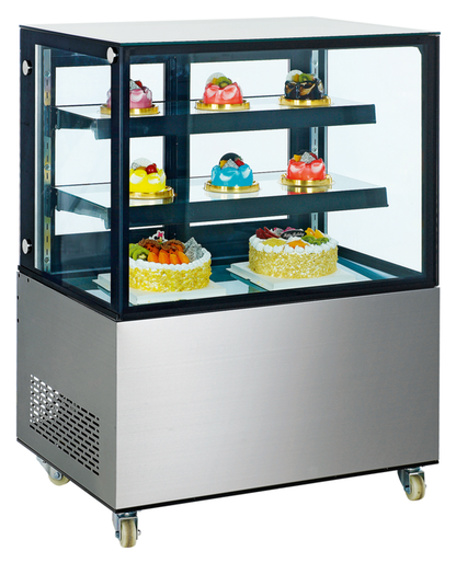 Kuchen- und Tortenvitrine Cube mit schwarzem Rahmen, weißem Sockel, drei Glasböden, zwei großen Torten unten, mehrere bunte Einzeltorten oben, auf Rollen